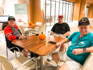 Ed Taylor (left), Julio Fernandez (middle) and Floyd Mishoe (right) are the first ones to arrive at the Center and the first to leave, patiently waiting for the doors to open at 5 a.m.