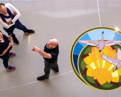 the crown jewels of the Center for Health & Wellbeing (CHWB) are the seven 6-foot resin-and-terrazzo medallions placed in the Commons’ terrazzo floor. Immensely intricate in detail and deliberate in their design, the medallions were created by Keri Caffrey, a local artist and Rollins College Fine Arts graduate who has worked with the Winter Park Health Foundation for more than two decades.